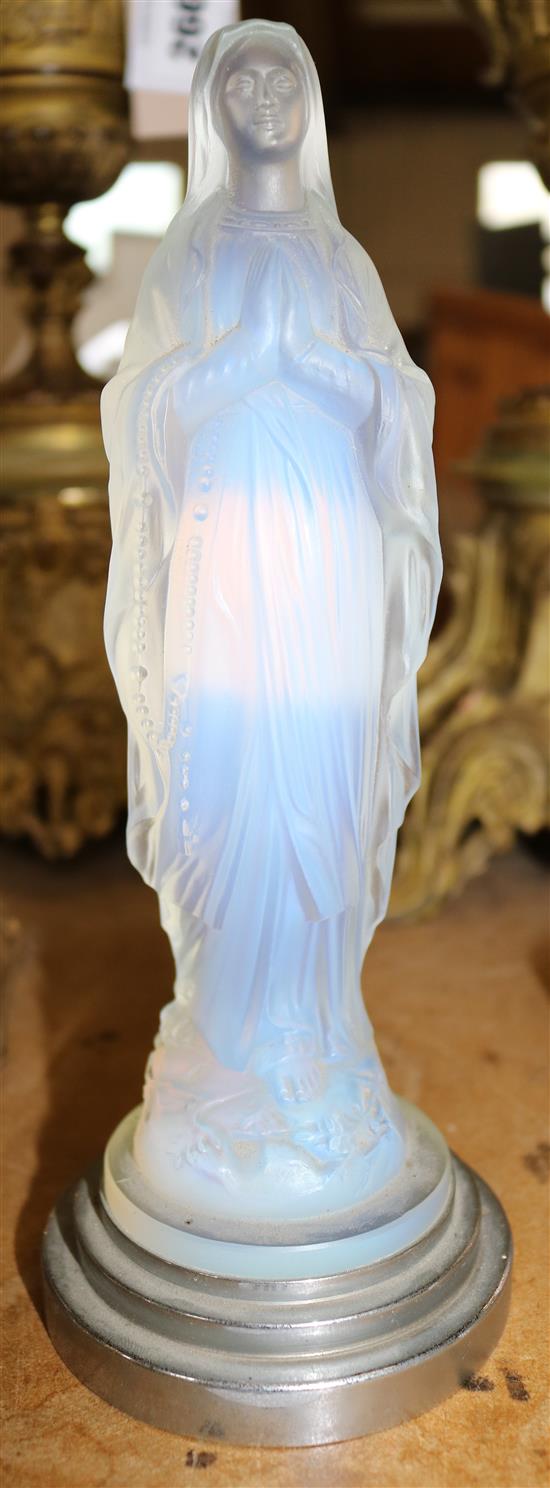 A Sabino moulded blue iridescent glass figure of The Madonna